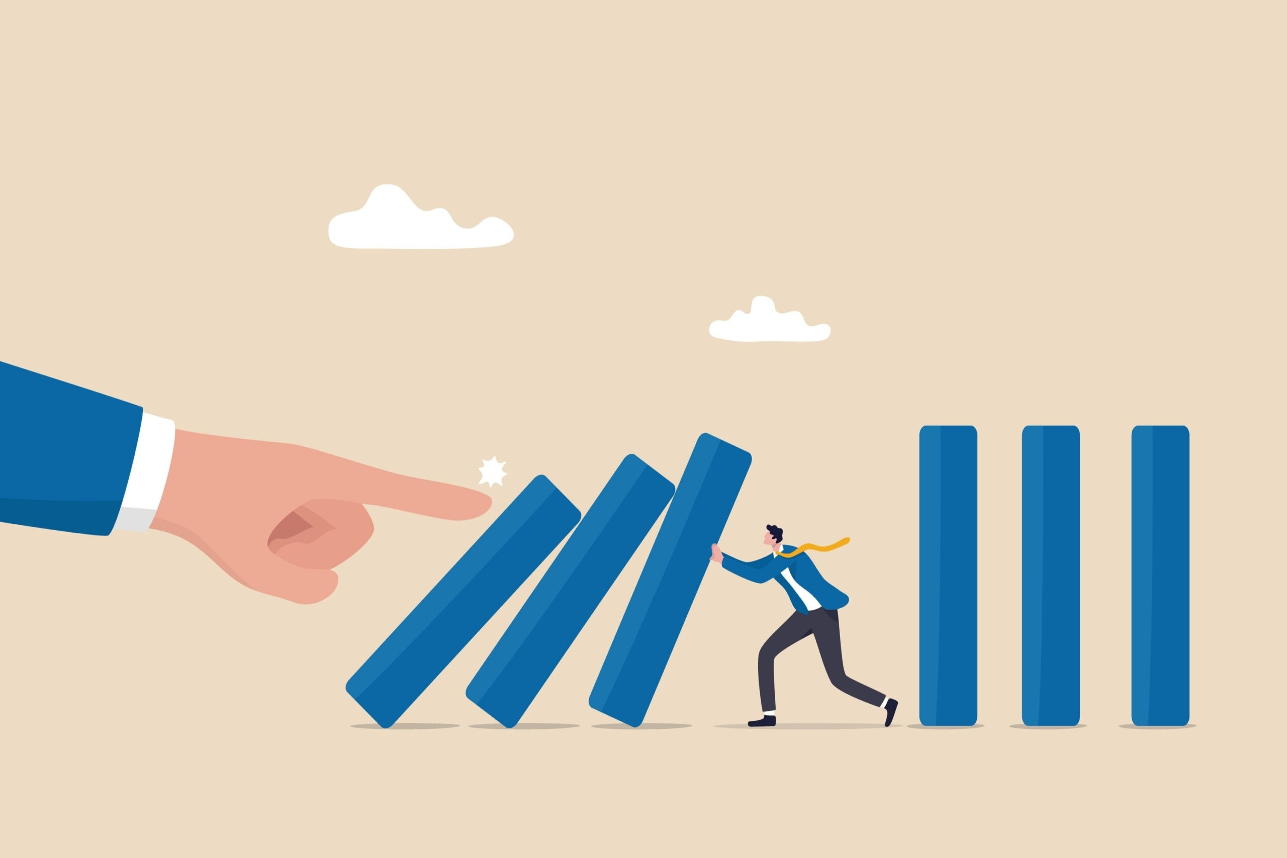 Concept of recession-proofing your business illustrated with a businessman preventing dominoes from falling, representing financial resilience, risk management, and stability strategies.